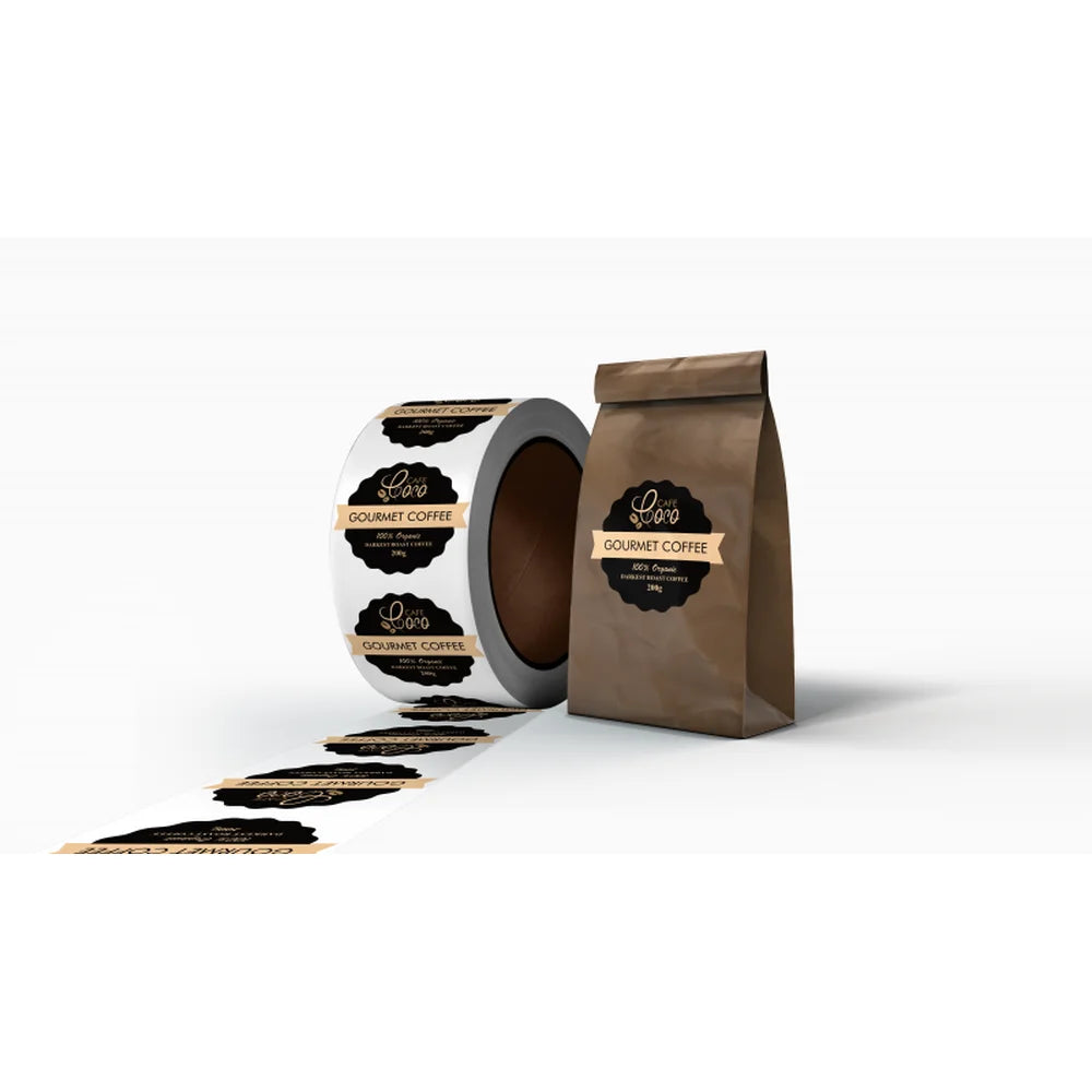 Gourmet coffee bag beside contour-cut roll labels printed with the UNINET Label Printer