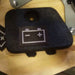 Example output: battery symbol label pressed onto a carpeted cover