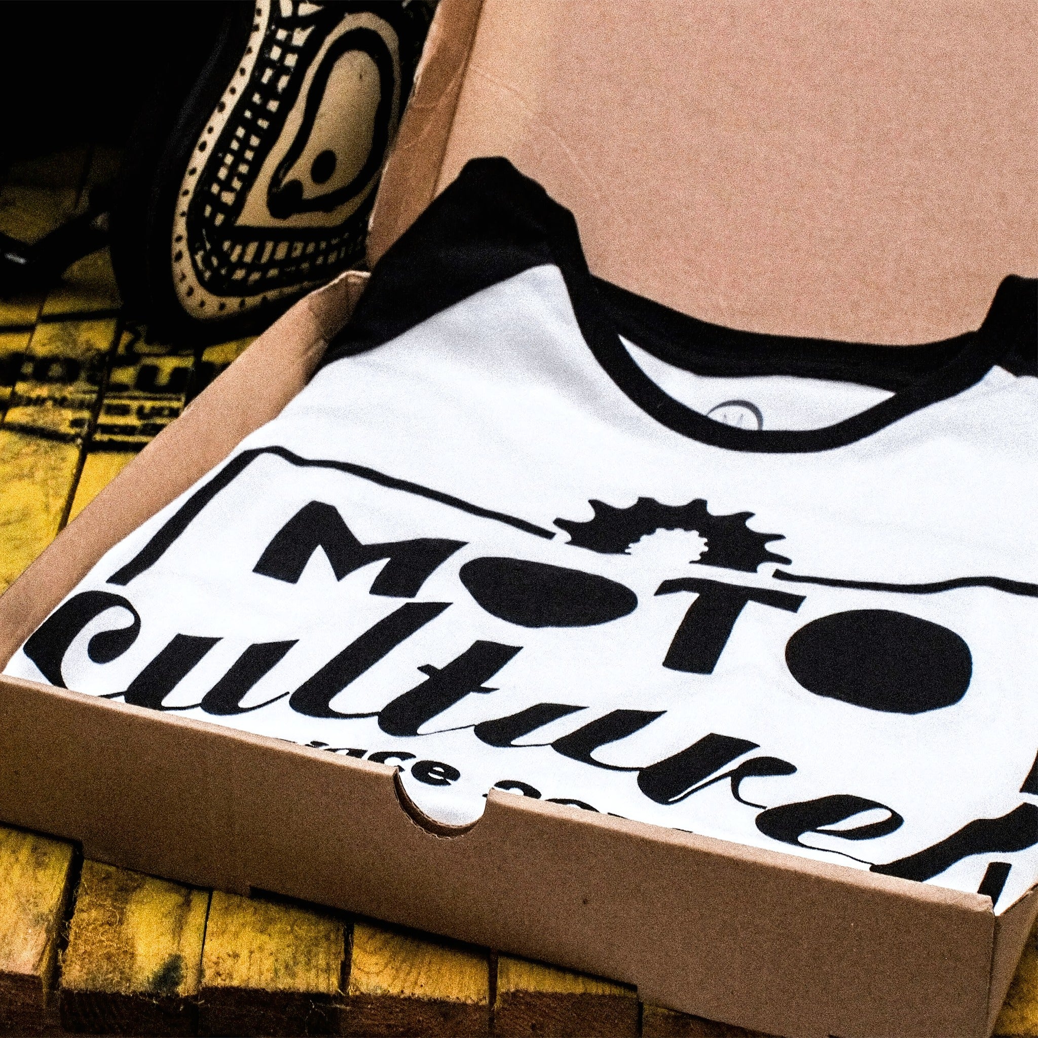 Example output: printed tee in a mailer box