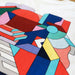 Example output: close up of a full color geometric print on a white tee