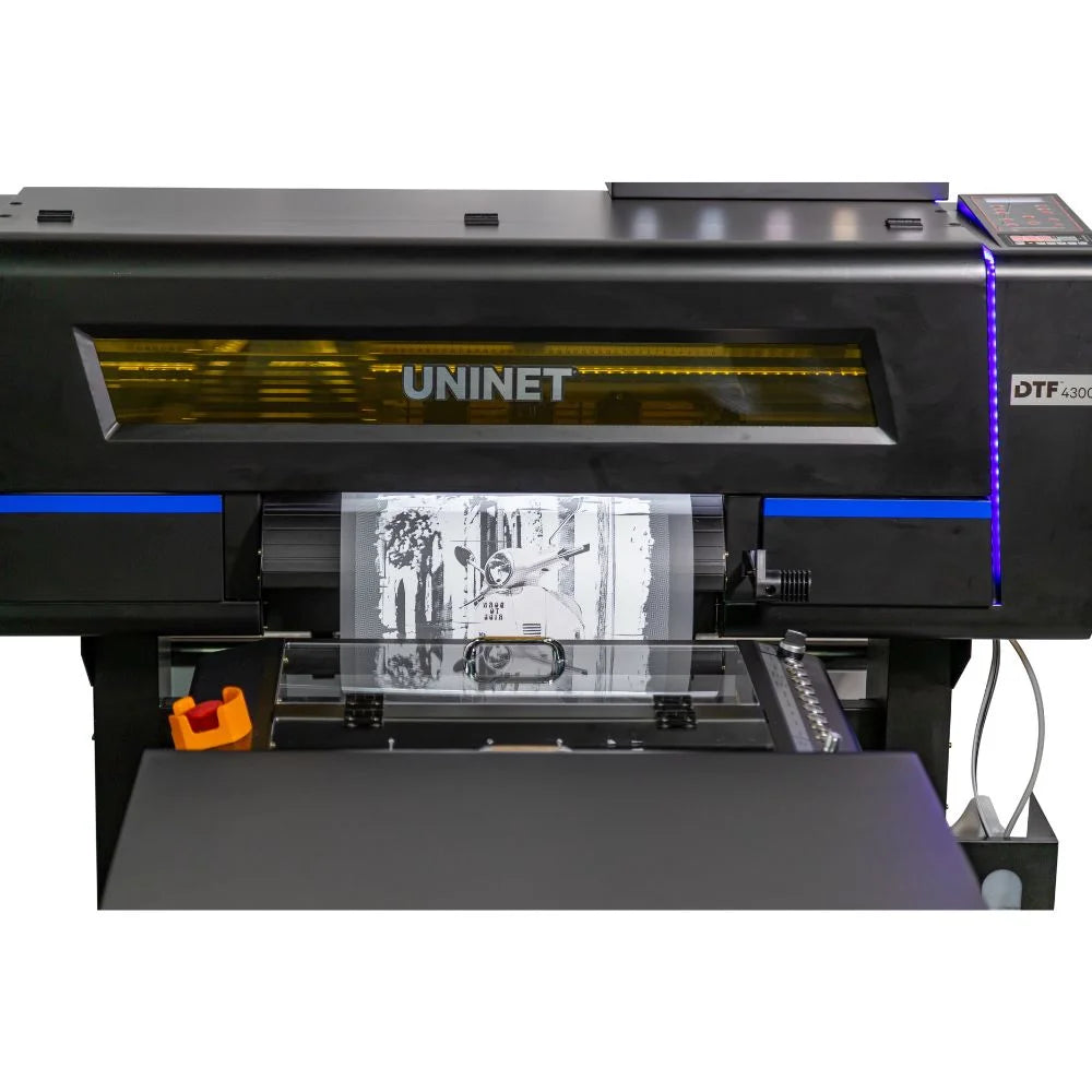 Uninet 4300 dtf printer close-up of print zone showing printhead window and monochrome graphic on film