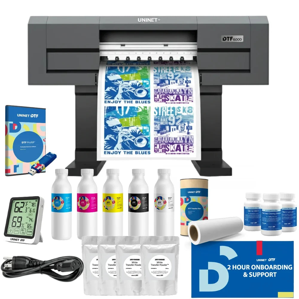uninet 6000 quad head printer front view surrounded by inks, powder, film, software and onboarding support kit