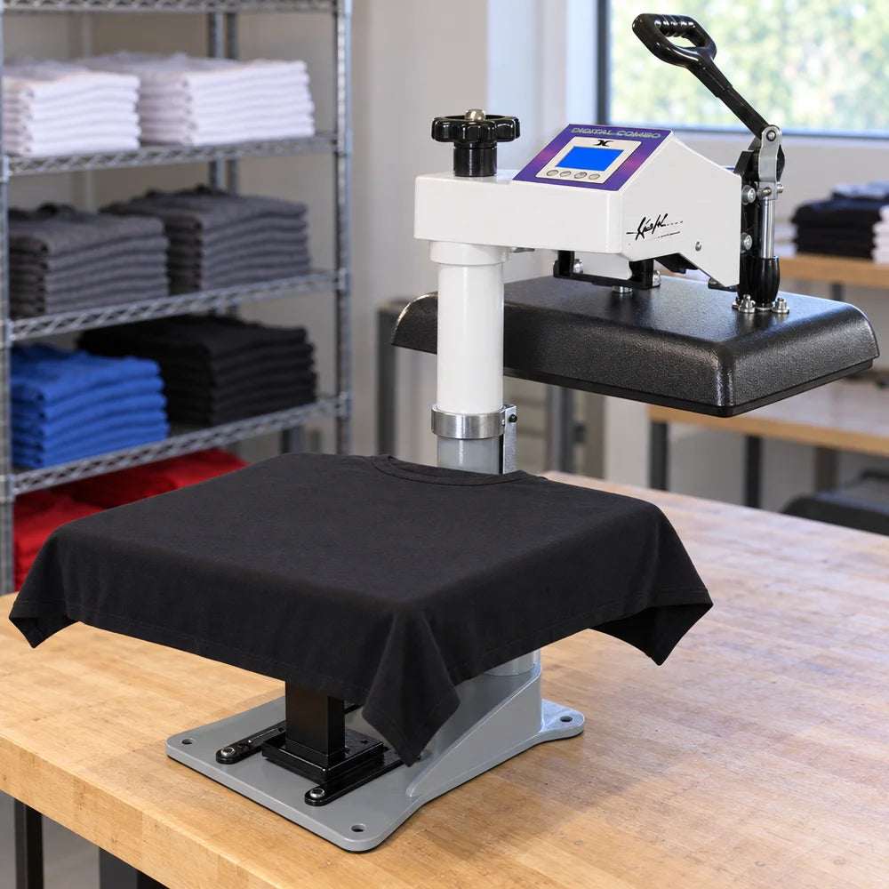 Black T shirt draped over the raised table with the heater swung back on the Geo Knight DC16 Digital Combo in a shop