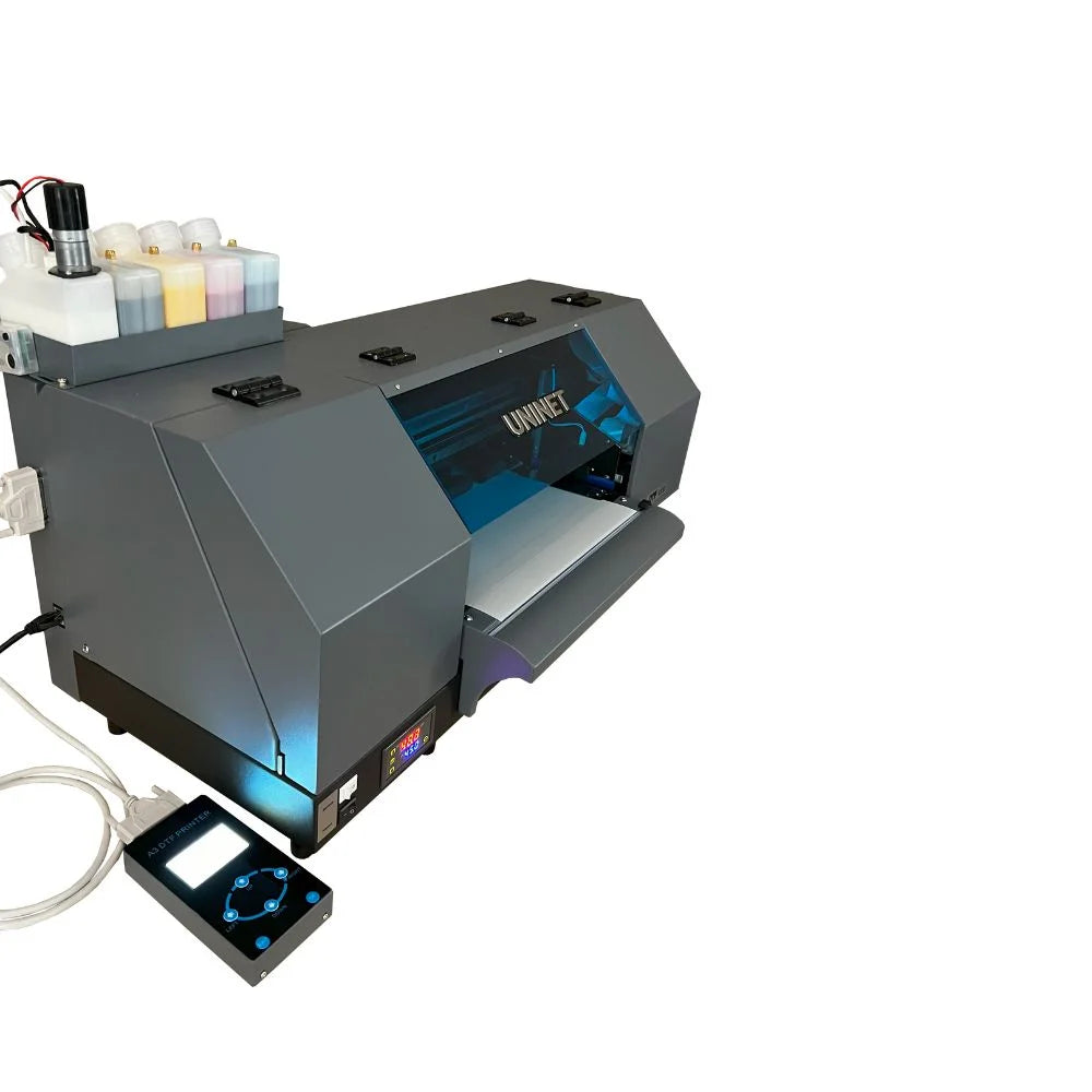 Angled front view of the Uninet DTF 1200 Dual Head Printer with lit interior, top ink bottles and attached control panel