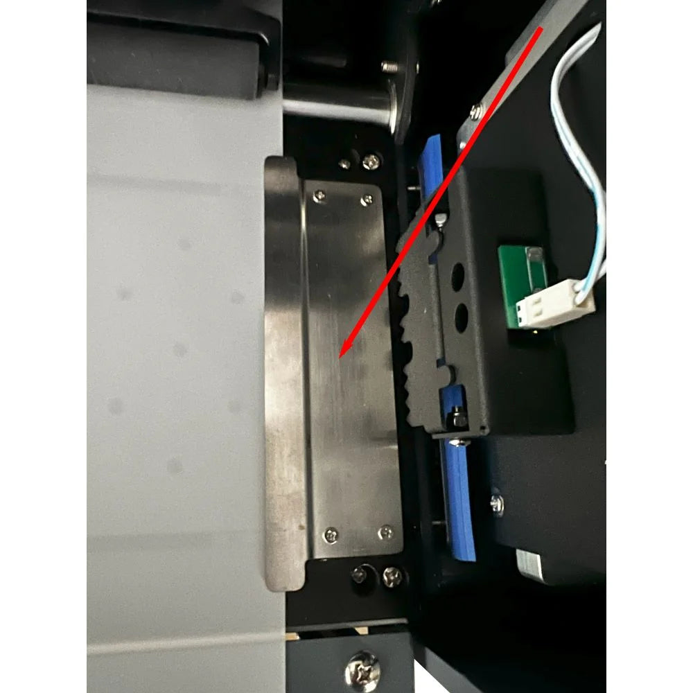 Interior of the Uninet DTF 1200 Dual Head Printer showing the drive belt, sensor board and carriage rail near the maintenance plate