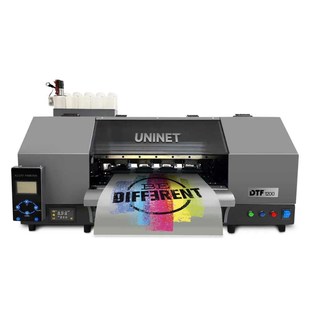 Front view of the uninet icolor 1200 with attached control panel, top ink bottles and a color transfer emerging from the printer