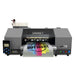 Front view of the uninet icolor 1200 with attached control panel, top ink bottles and a color transfer emerging from the printer