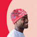 Red beanie with snowflake print worn by a smiling man made using UNINET IColor Premium 2 Step Transfer Paper Kit A4