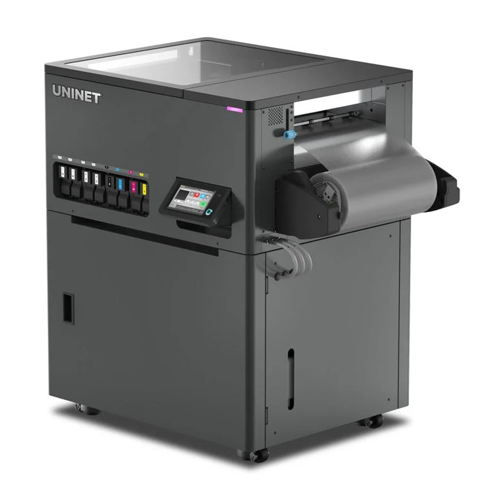 Slight side angle of the Icolorprint UNINET DTF Xpress showing ink bay, touchscreen and media roll on a white background