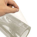 Hand lifting the protective layer from Procolored Clear UV DTF AB Film for A3 Printer A roll