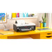 Procolored l805 dtf a4 printer set up on a yellow home studio desk with lamp, plant, and framed wall art