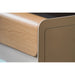 Close-up of the procolored p13 wood-grain front panel and rounded matte housing corner showing home-friendly design finish