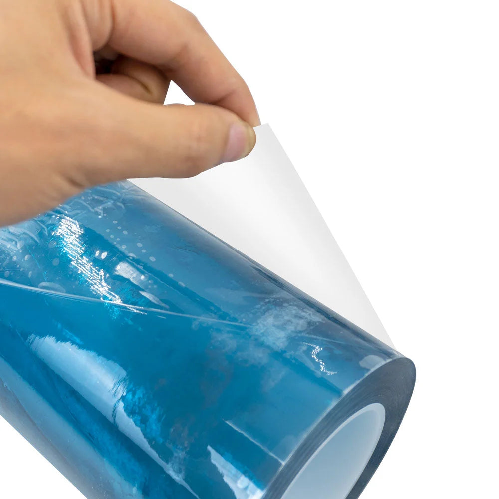 Hand peeling a clear layer from Procolored Clear UV DTF AB Film for A3 Printer with blue covering