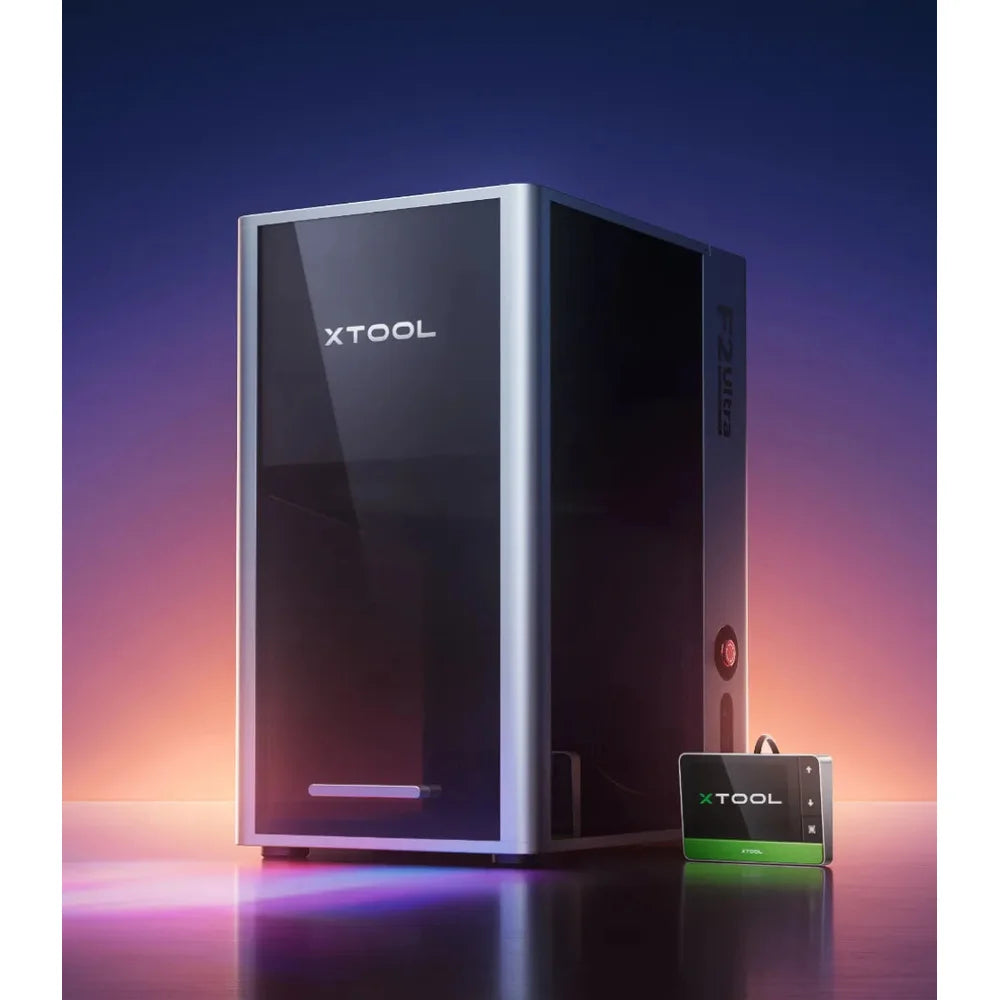 Three-quarter studio view of the closed xTool F2 Ultra 60W MOPA and touchscreen controller