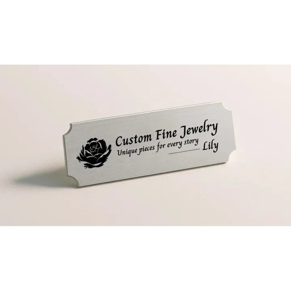 Silver jewelry nameplate engraved with a rose using xTool F2 Ultra 60W MOPA