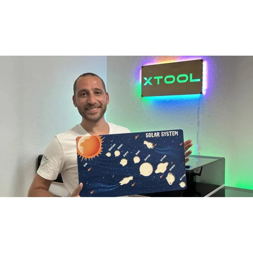 Alternate solar-system project view with the xTool O1 Omni UV DTF Printer behind the maker