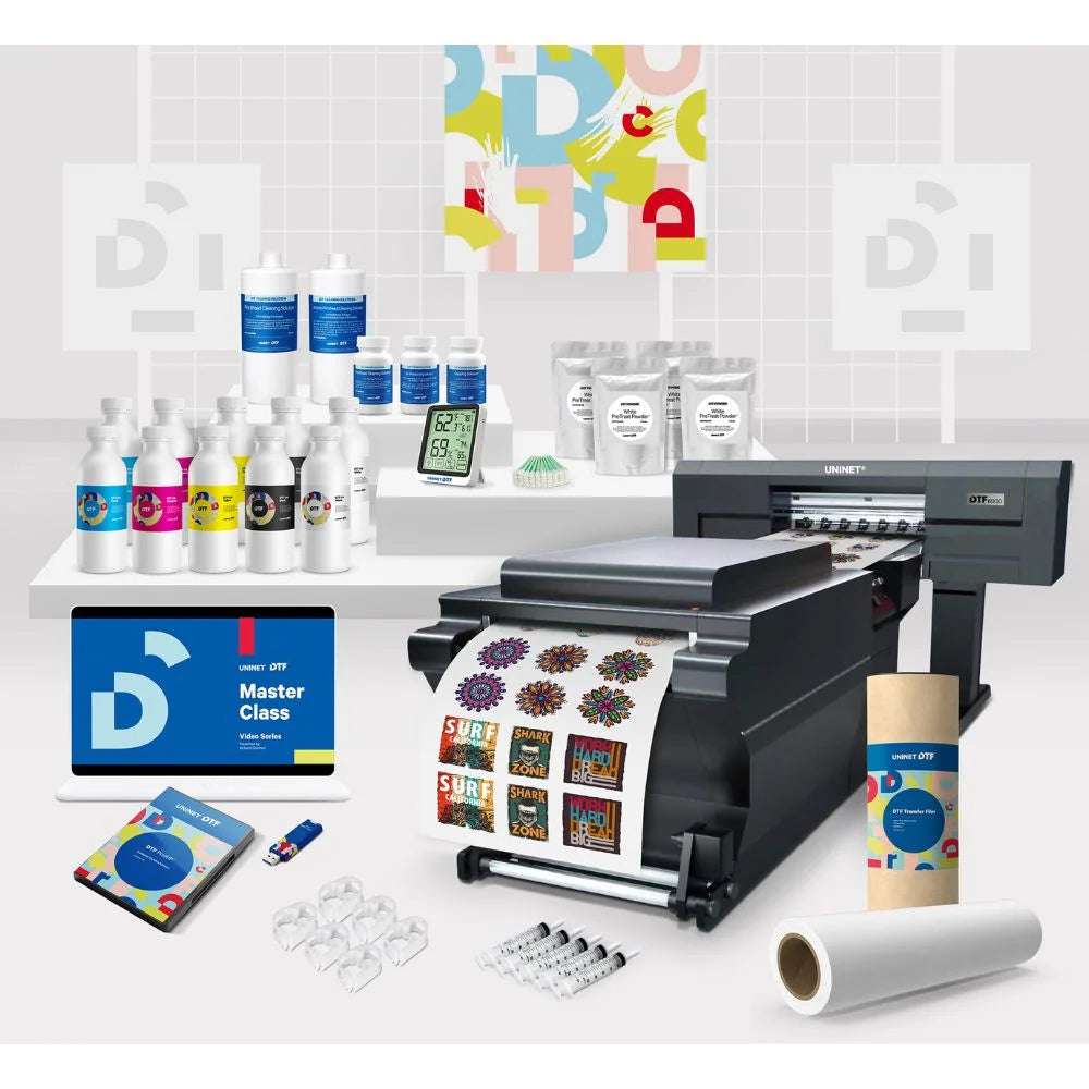 Bundle layout with inks, powder, film, software beside the Uninet 6000 Direct To Film (DTF) Quad Head Roll Printer.