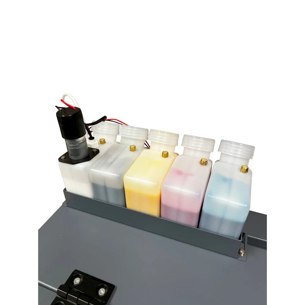 Close-up of the uninet 1200 dtf printer five color ink bottles and agitation pump making up the continuous feed white ink system