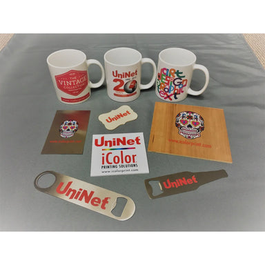 Mugs, printed metal and wood panels, stickers and bottle openers made with the UNINET IColor Hard Surface Sample Paper Kit