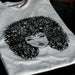 Example output: white tee with a black illustrated portrait print