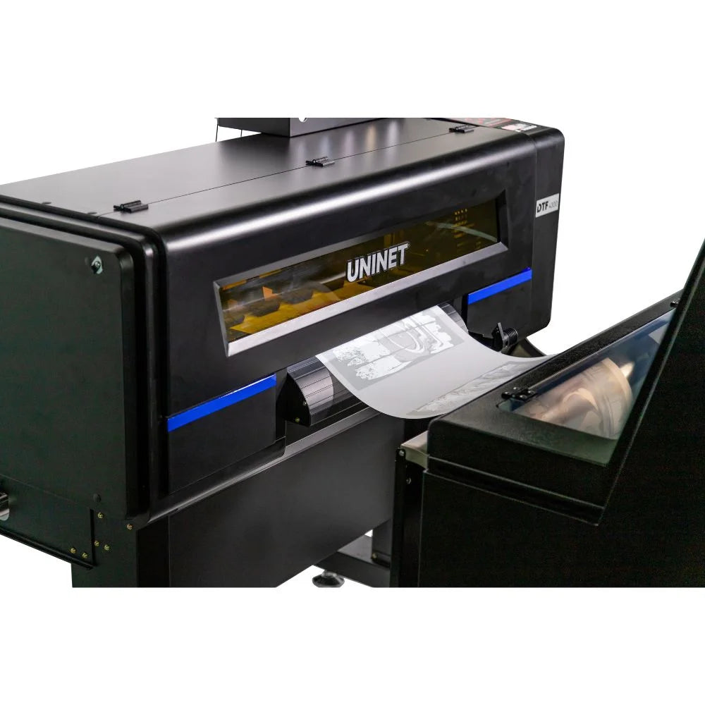 dtf 4300 close-up of front film output area feeding a printed graphic toward the shaker inlet
