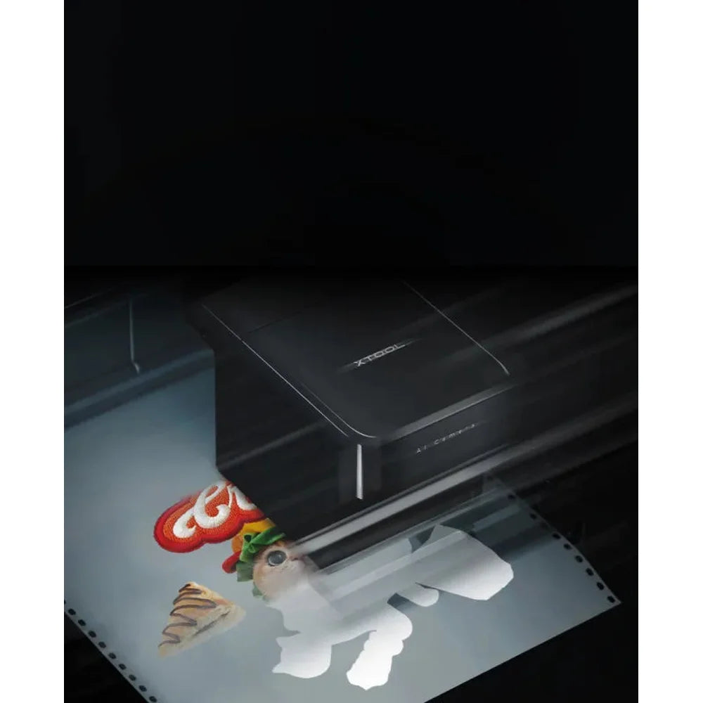 Camera and print carriage working over transfer film during an xTool Apparel Printer setup sequence