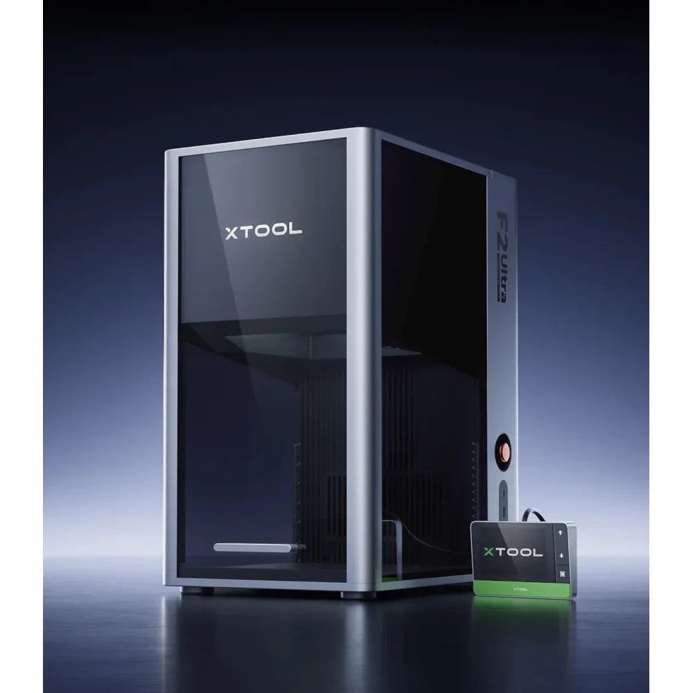 Open-front xTool F2 Ultra on a dark studio set with its touchscreen controller beside it